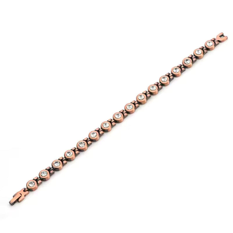 copper stone bracelet with a slim row of round crystals, angled on a white background
