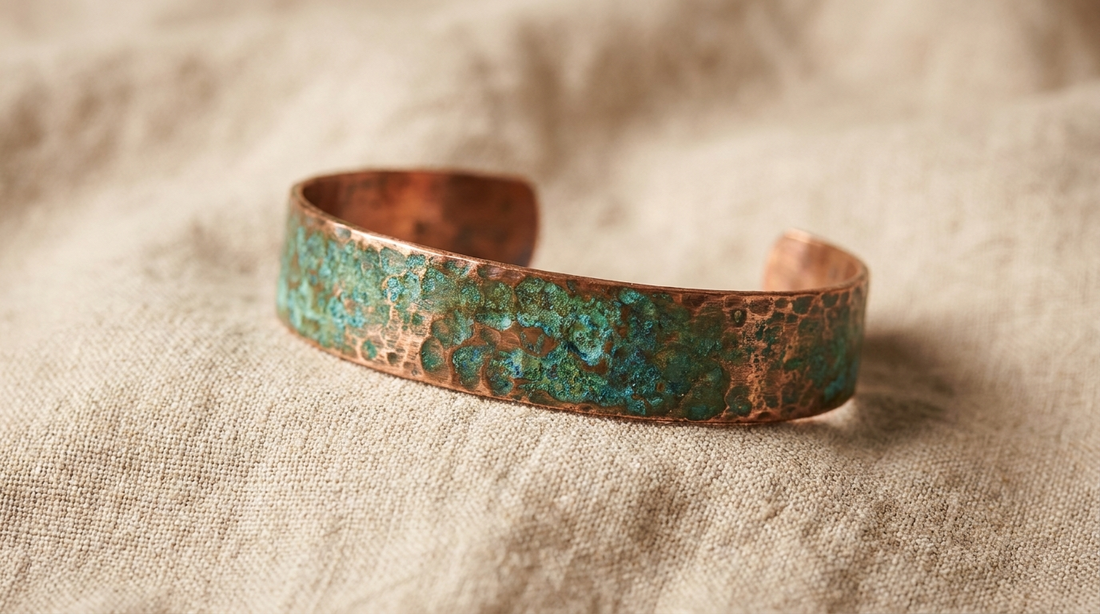 Close-up of a warm copper cuff bracelet with natural aged patina