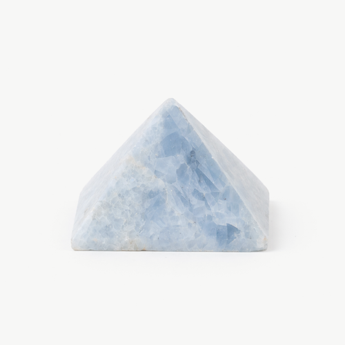 Aquamarine crystal pyramid in pale banded blue stone on a white background