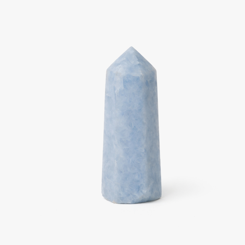 Aquamarine crystal tower with a polished pale blue point on a white background