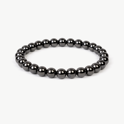 Hematite Grounding beaded bracelet with metallic silver-grey round stones on a stretch cord