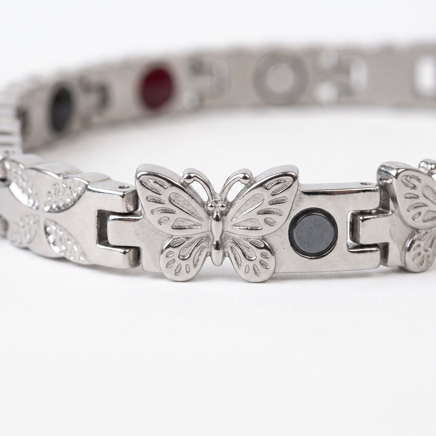 butterfly silver bracelet - macro detail of butterfly charm and links